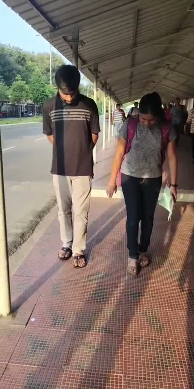 Yazhini and Rahul walking out of college